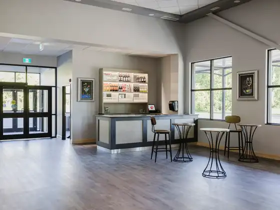 Bar and high-top tables near the entrance of Legacy Events