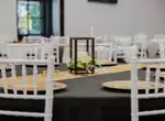 Table with a lantern centrepiece and gold chargers