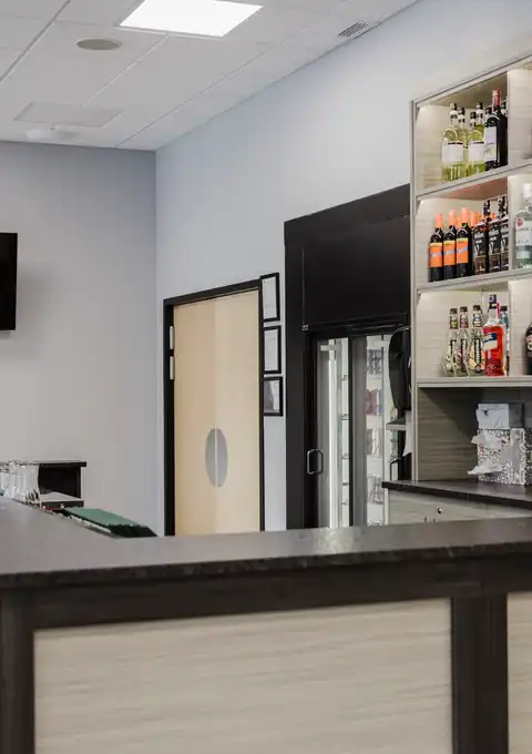 Bar counter with stocked shelves inside Legacy Events